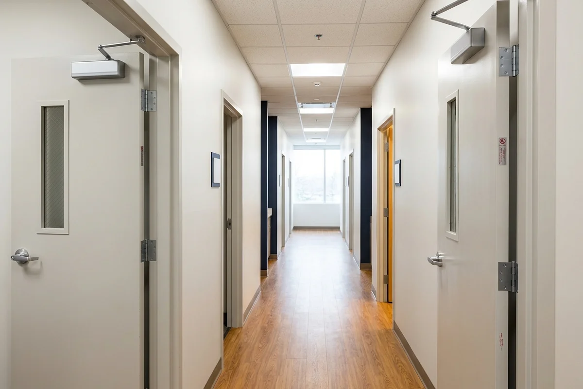 Medical office corridor with new hollow metal frames and 60-minute fire doors in Markham